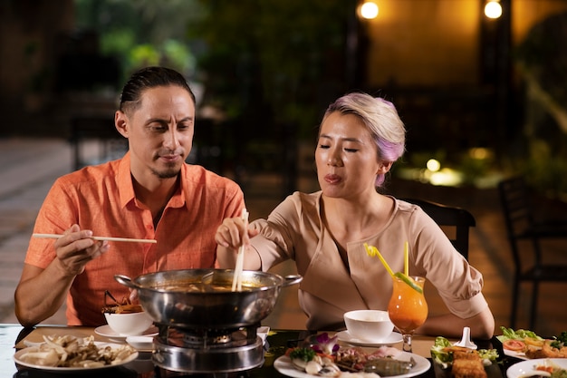 Asian people having dinner party