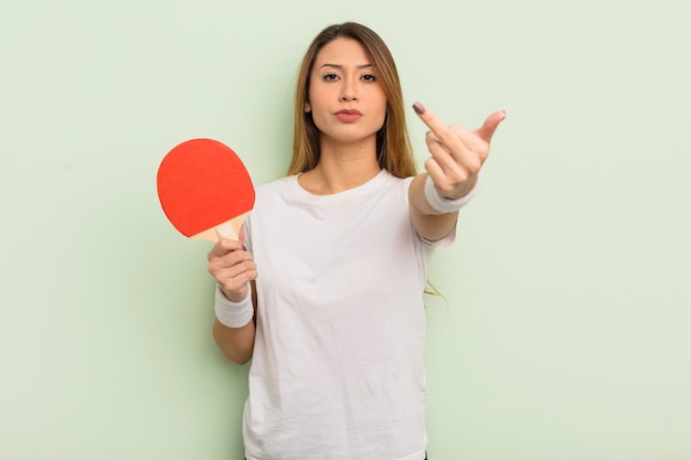 Asian pretty woman feeling angry annoyed rebellious and aggressive ping pong concept