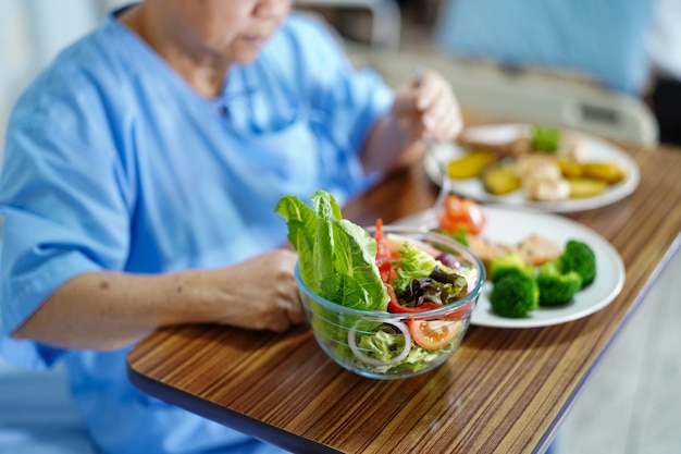 Asian senior or elderly old lady woman patient eating breakfast healthy food