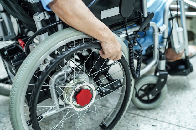 Photo asian senior or elderly old lady woman patient on electric wheelchair at nursing hospital