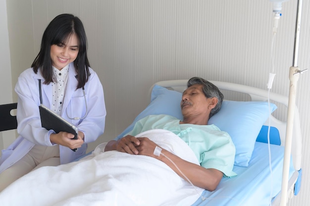 Asian senior male patient is consulting and visiting doctor in hospitalx9xA