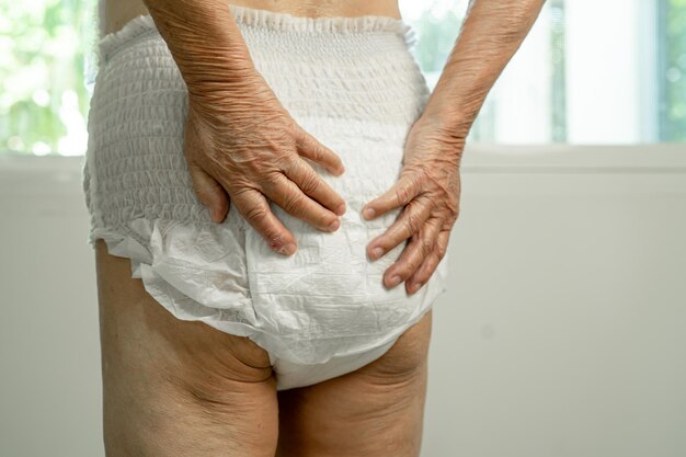 Asian senior woman patient wearing incontinence diaper in hospital healthy strong medical concept