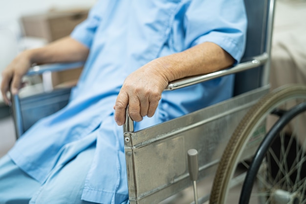 Asian senior woman patient on wheelchair at nursing hospital