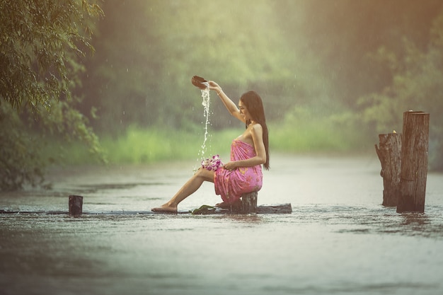 Asian sexy women bathing in the rain