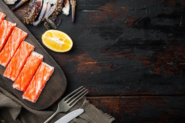 Asian snack surimi set, on dark wooden table, top view flat lay