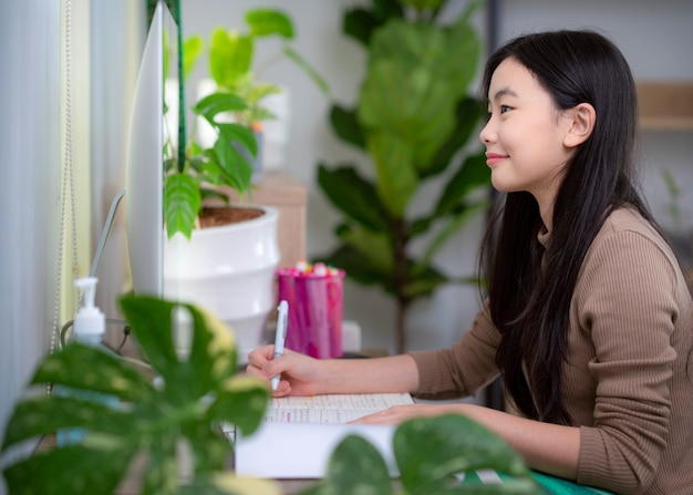 Asian student learning by use computer and internet at home