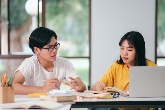 An asian students are reading books and study Tutoring together