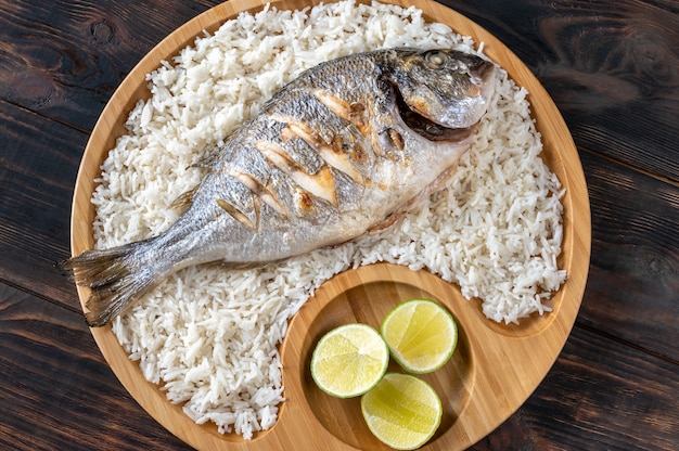 Asian-style grilled dorada garnished with white rice