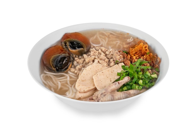 Asian style rice soup with herbs in a bowl over white background