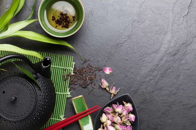 Asian sushi chopsticks rose tea and teapot