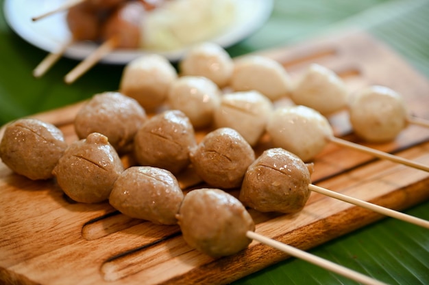 Asian Thai street food style Grilled meat balls stick grilled pork balls stick on a wooden board