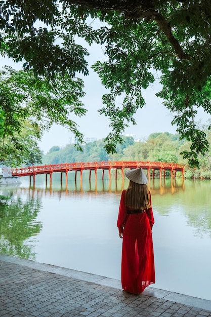 Asian travel to The Huc bridge entrance to Ngoc Son temple on Hoan Kiem lake Hanoi Vietnam