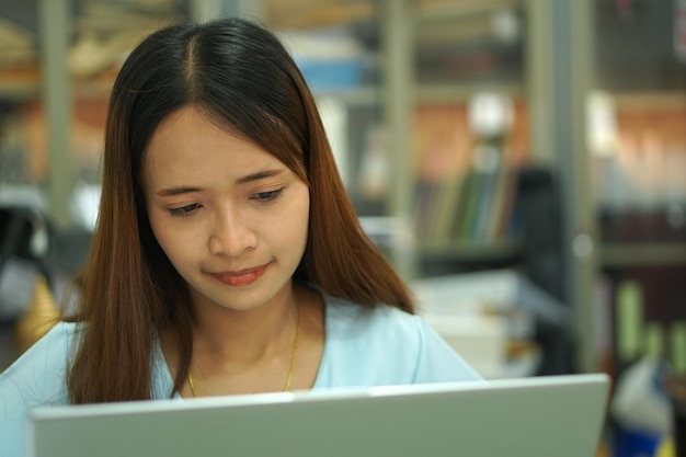 Asian woman analyzing computer work plan