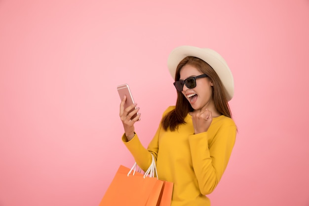 Asian woman are shopping in the summer casual clothes yellow dress