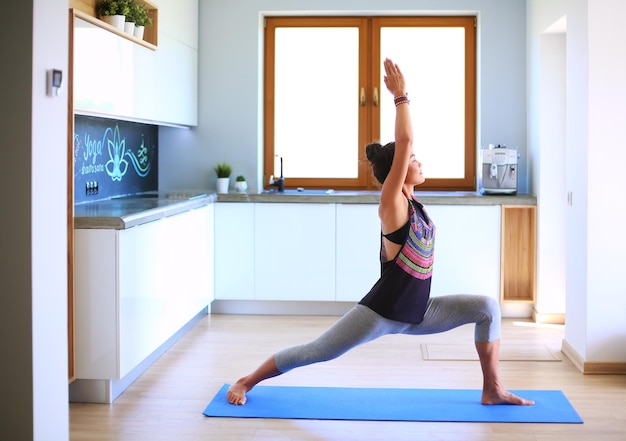 Asian woman are yoga exercises at home