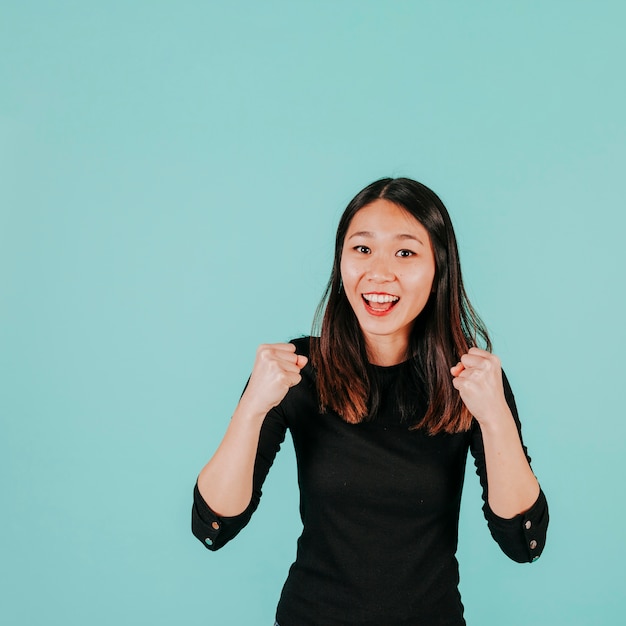 Asian woman celebrating success