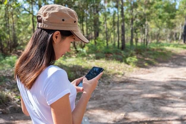 Asian woman checking her phone