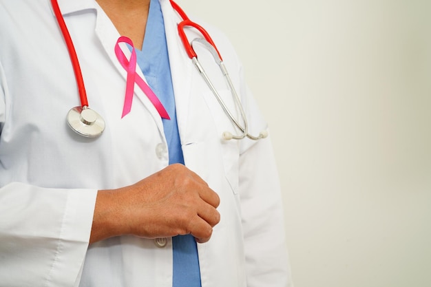 Asian woman doctor with pink ribbon World Breast Cancer Day at October