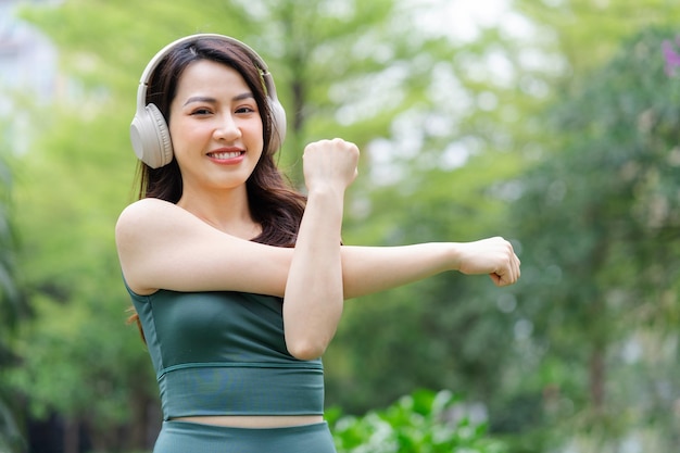 Asian woman exercising at the park