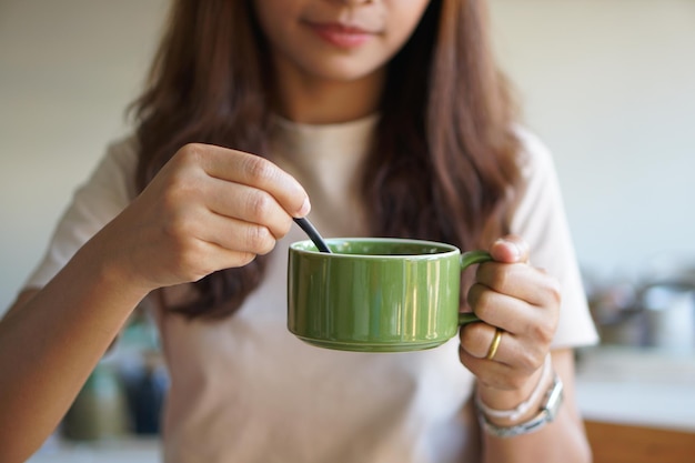 Asian woman going to drink coffee in the morning