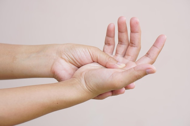 Asian woman having hand numbness