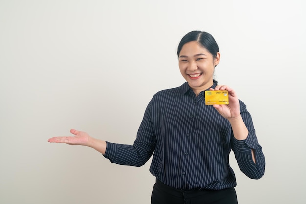 Asian woman holding credit card with white background