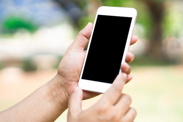 Asian woman holding mobile phone to communication in business.