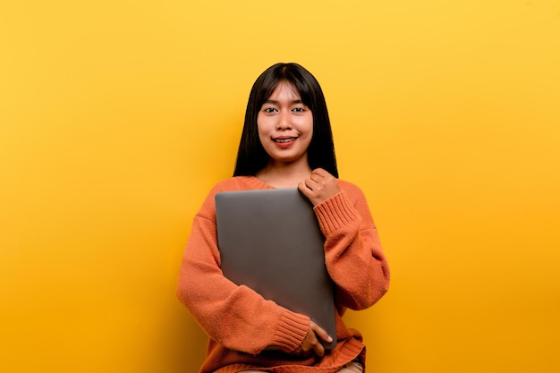 Asian woman and laptop and are happy to work Photo of a beautiful Asian woman who is happy working