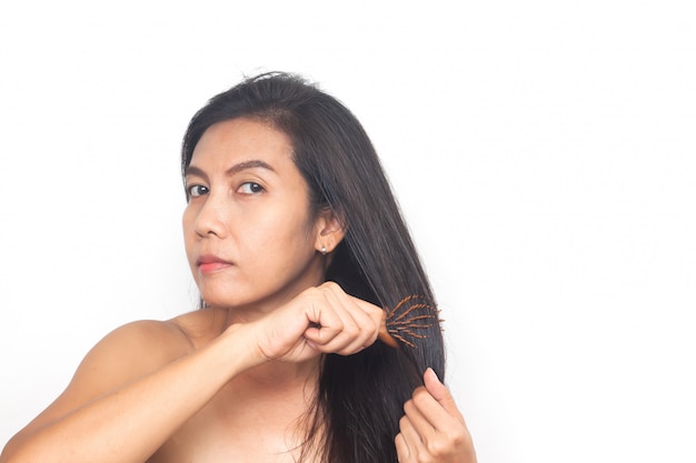  Asian woman long black hair on white background. Health and surgery 