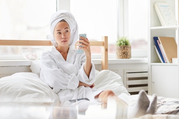 Asian Woman Relaxing in Morning