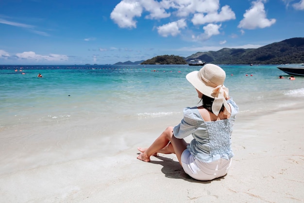 Asian woman relaxing on the sandy beach Lipe Thailand