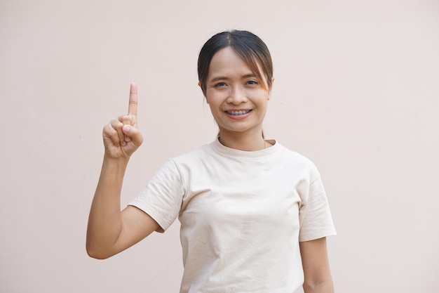 Asian woman smiling happily accomplishing tasks