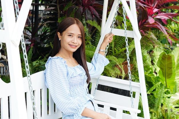 Asian woman smiling happily in a cafe