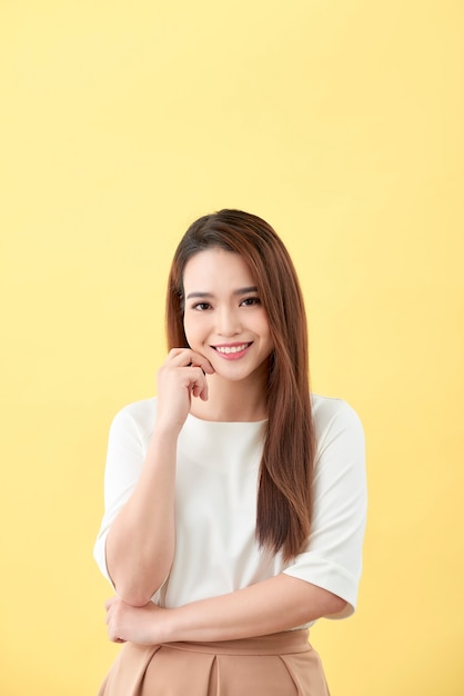 Asian woman smiling with dimple long hair black eyes on yellow background cute nice girl face vintage style Beautiful Asian girl oriental girl black hair long teenager young model student pretty