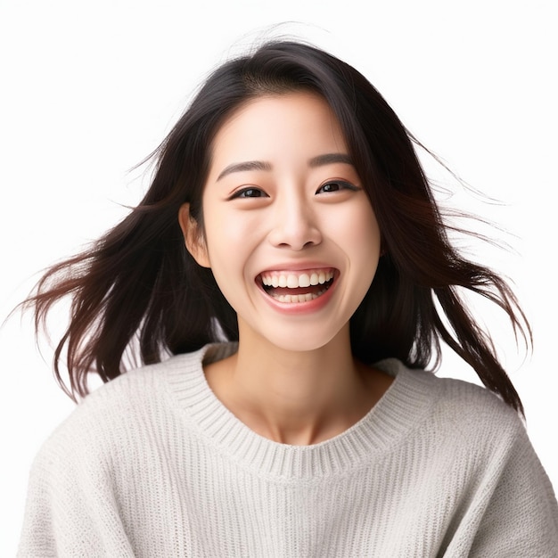 asian woman stands in front of a white background with her hands on her hips