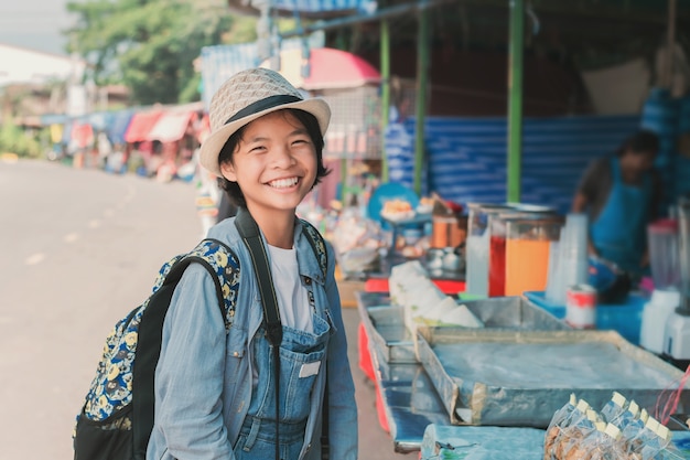 Asian woman traveler shopping walking on street market 