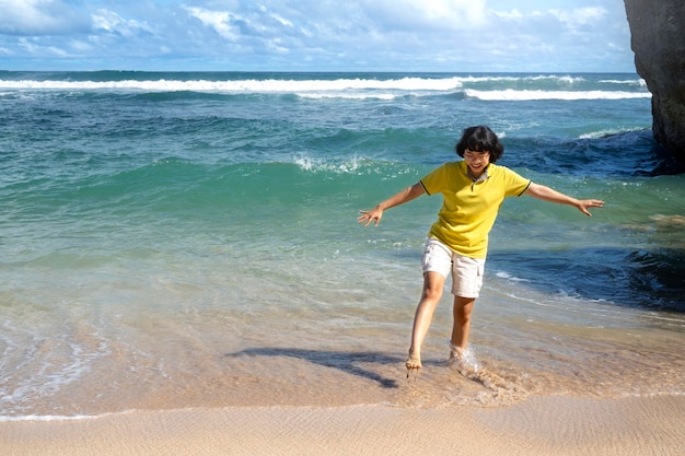 Asian woman traveling on the beach