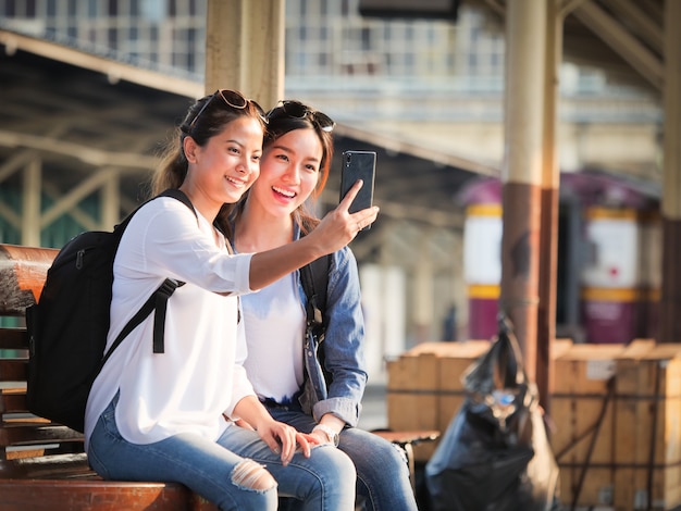 Asian woman traveling with mobile phone 