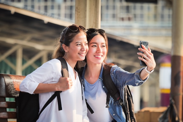 Asian woman traveling with mobile phone 