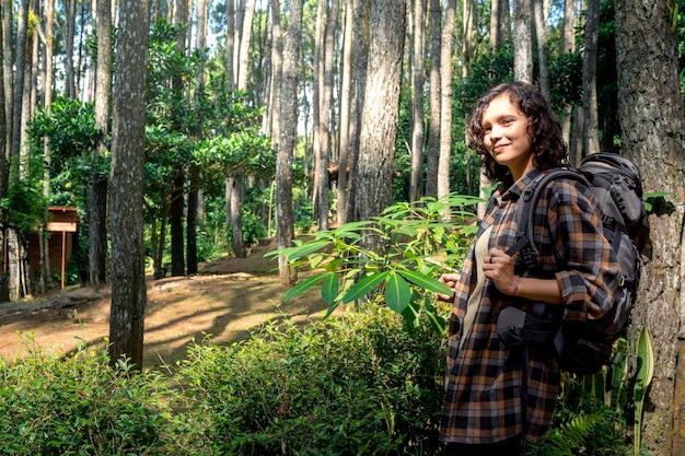 Asian woman trekking in the forest