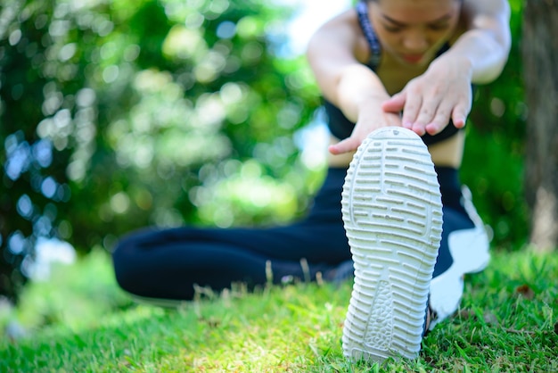 Asian woman warm up before work out in a morningslim girl exercise for life