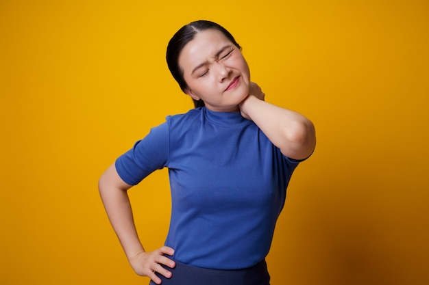 Asian woman was sick with body pain touching her body.