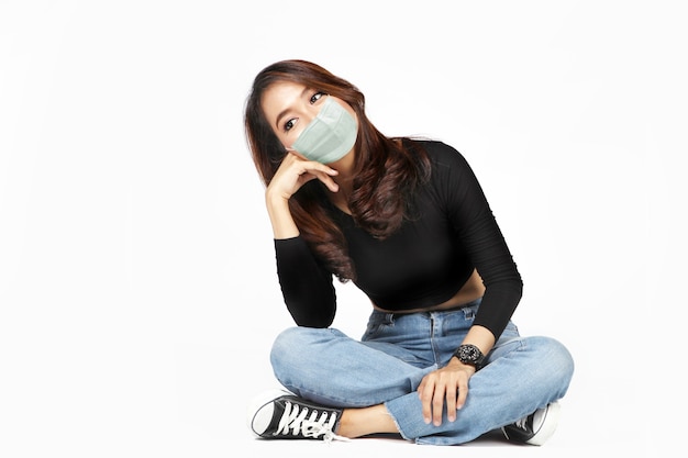 Asian woman wearing face mask with casual clothes isolated