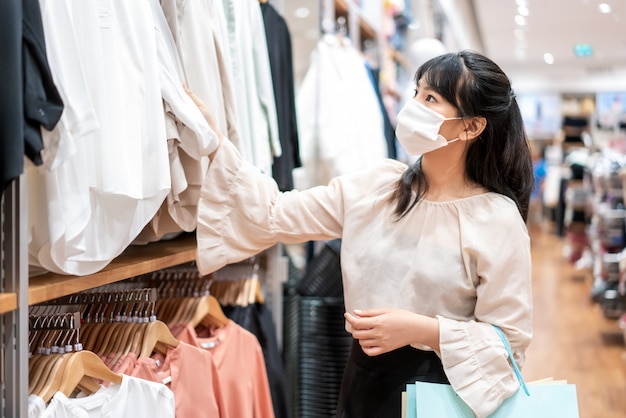 Asian woman wearing protective mask at the mall