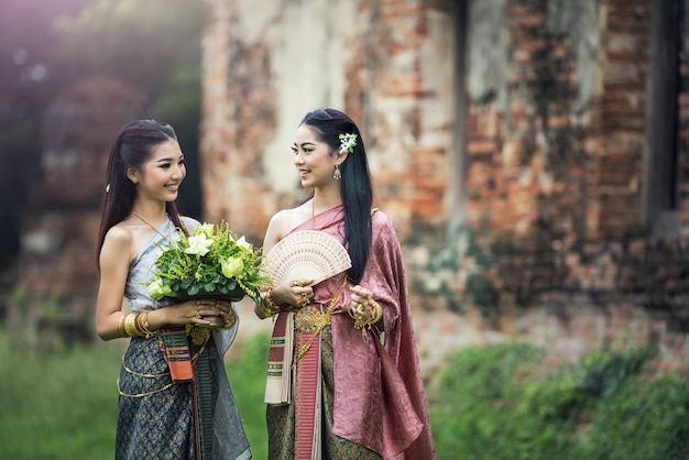 Asian woman wearing typical Thai dress, vintage original Thailand attire