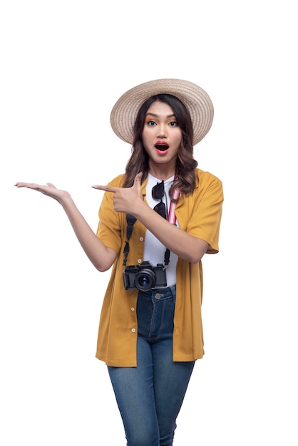 Asian woman with a hat and camera with open palm pointing at something