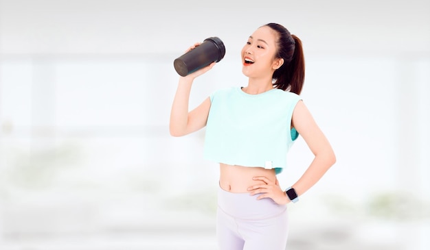 Asian woman with healthy diet protein shake drinking for sport and fitness