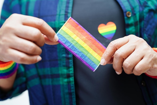 Asian woman with rainbow flag LGBT symbol rights and gender equality LGBT Pride Month in June