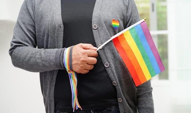 Asian woman with rainbow flag LGBT symbol rights and gender equality LGBT Pride Month in June