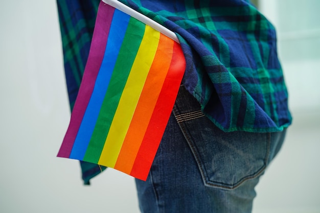 Asian woman with rainbow flag LGBT symbol rights and gender equality LGBT Pride Month in June